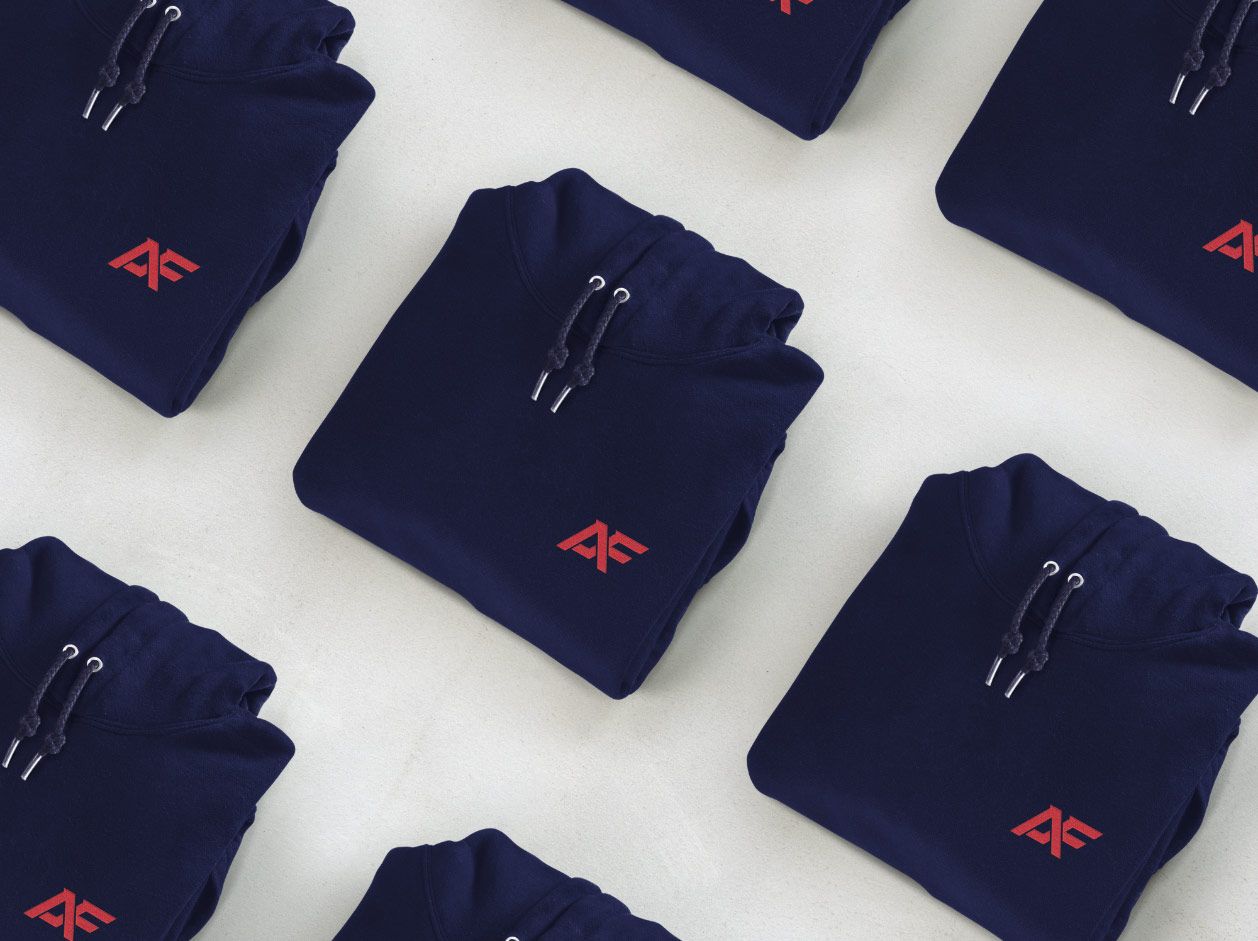 A set of navy hoodies with the Adapt Fitness logo