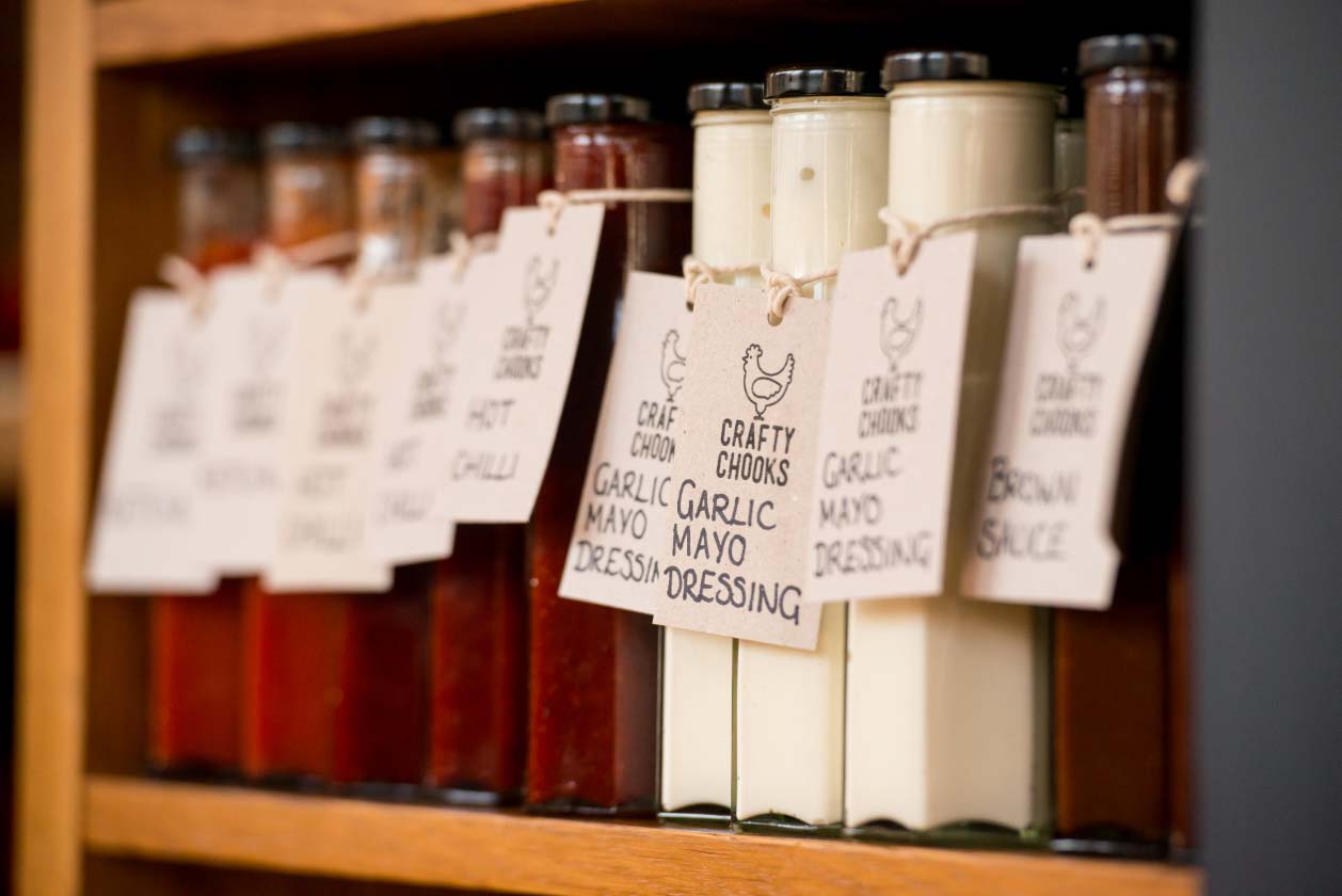 Bottles of sauces with tags