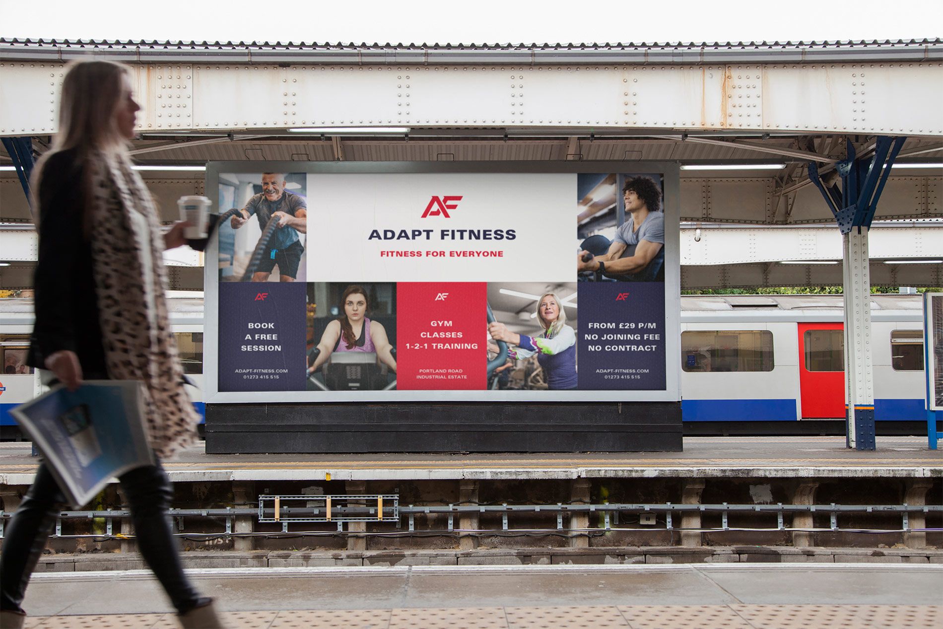 A gym billboard displayed in a train station
