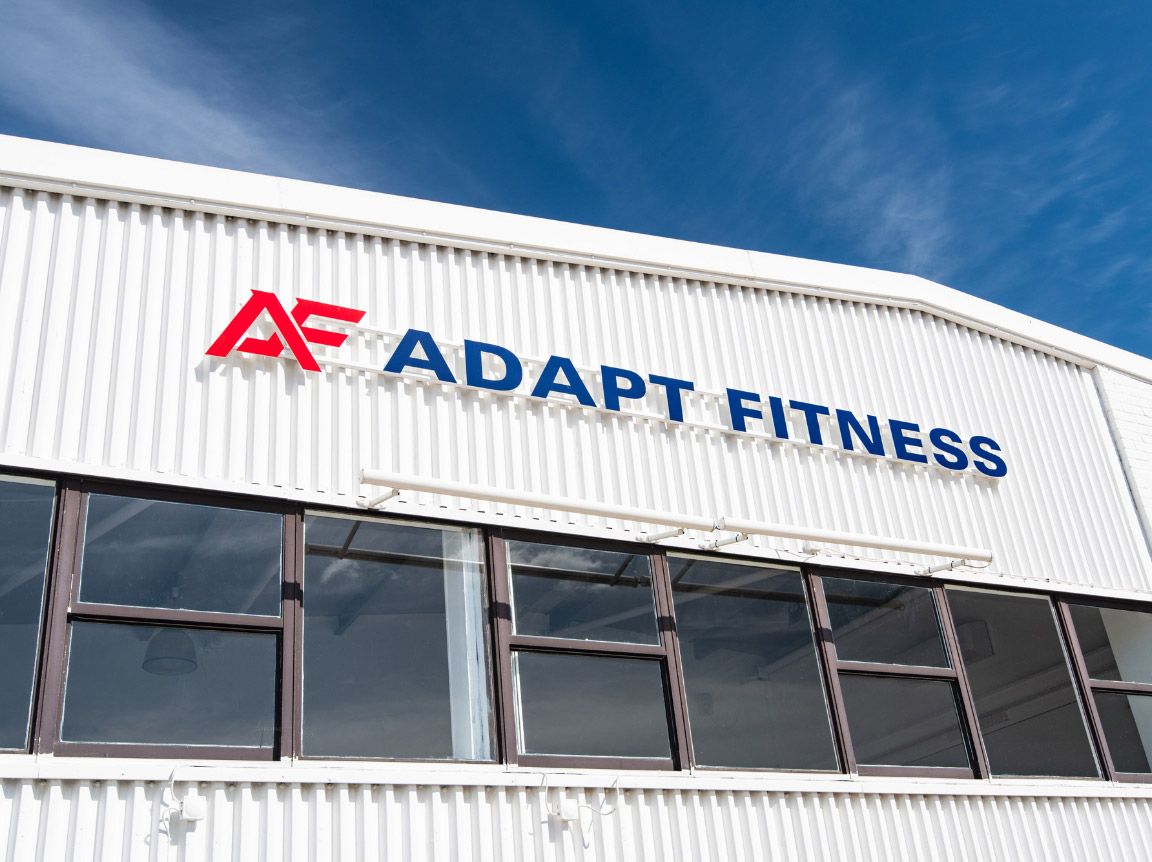 A close up of the Adapt Fitness large exterior sign