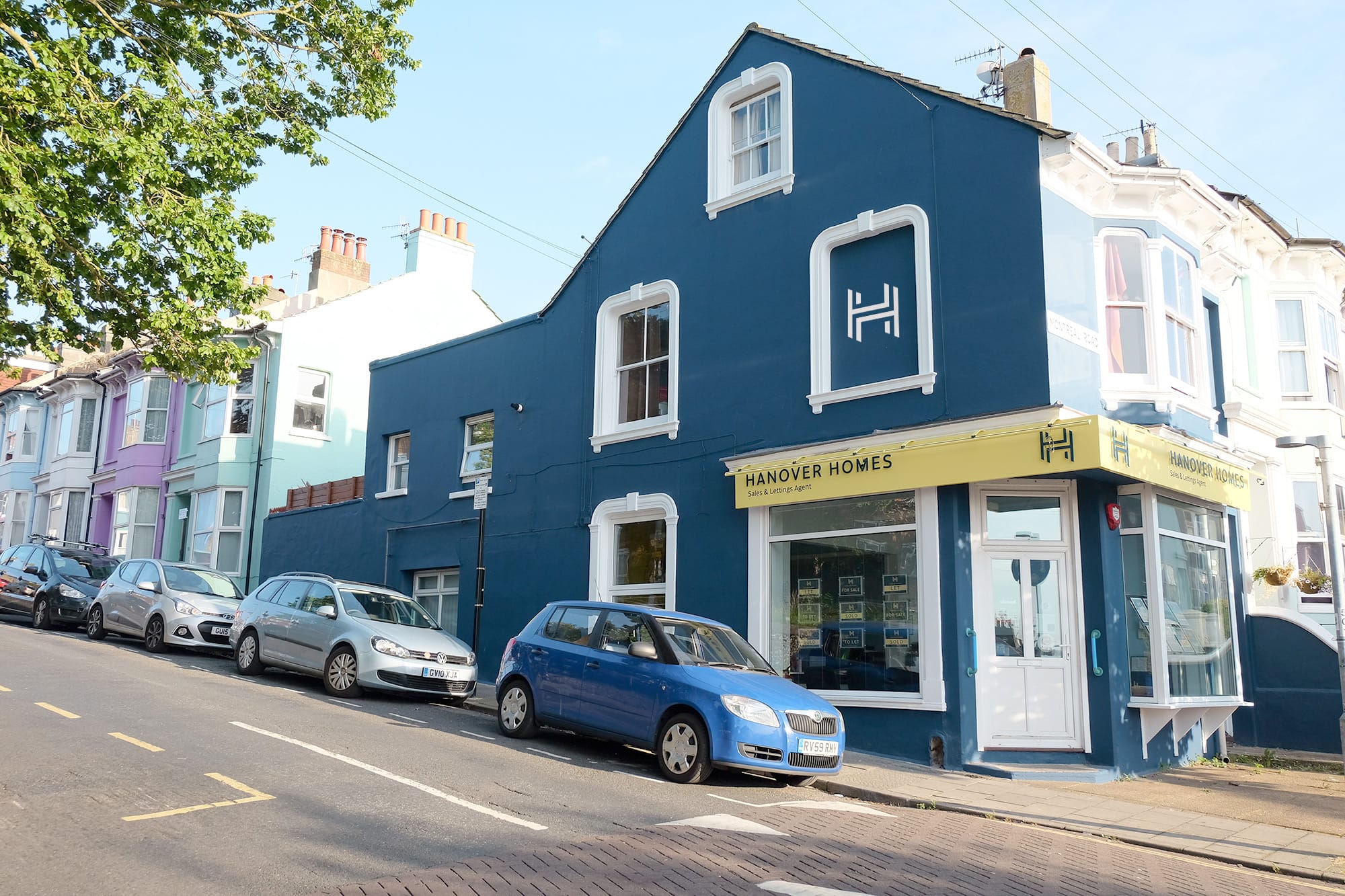 An exterior photo of the estate agent office showcasing the signage design